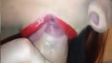 Girl with red lipstick giving a blowjob