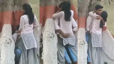 College couple enjoys outdoor sex below a big tree
